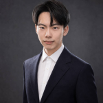 古凱棋正式肖像，身著深色西裝的半身人像